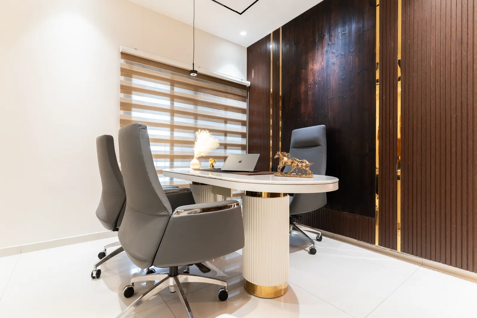 Home office desk with grey executive chairs and fluted walnut wall — Abhishek's Residence